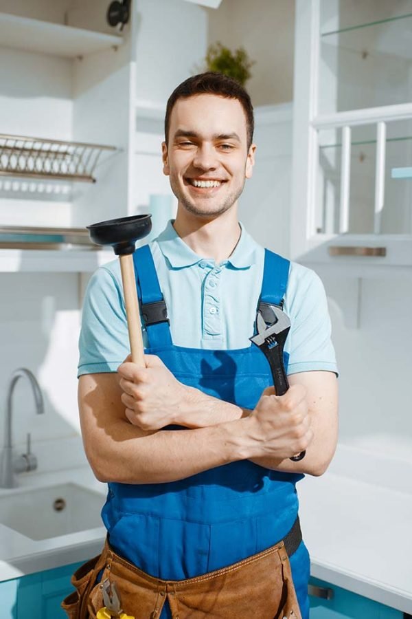 cheerful-male-plumber-holds-wrench-and-plunger-resize.jpg plumbing saint george utah