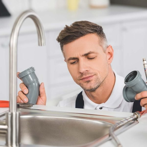 thoughtful-adult-repairman-holding-pipes-and-tools-resize.jpg Water Heater Repairs