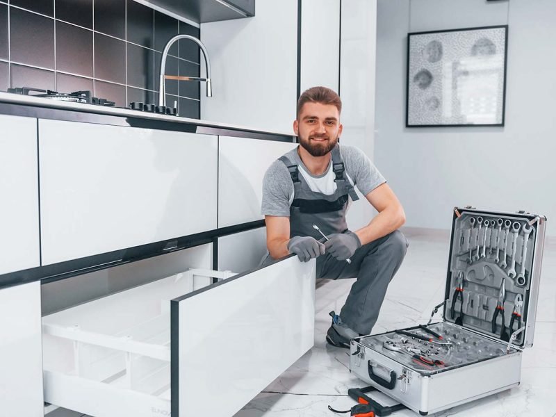 young-professional-plumber-in-grey-uniform-using-e-resize.jpg Plumbers St George